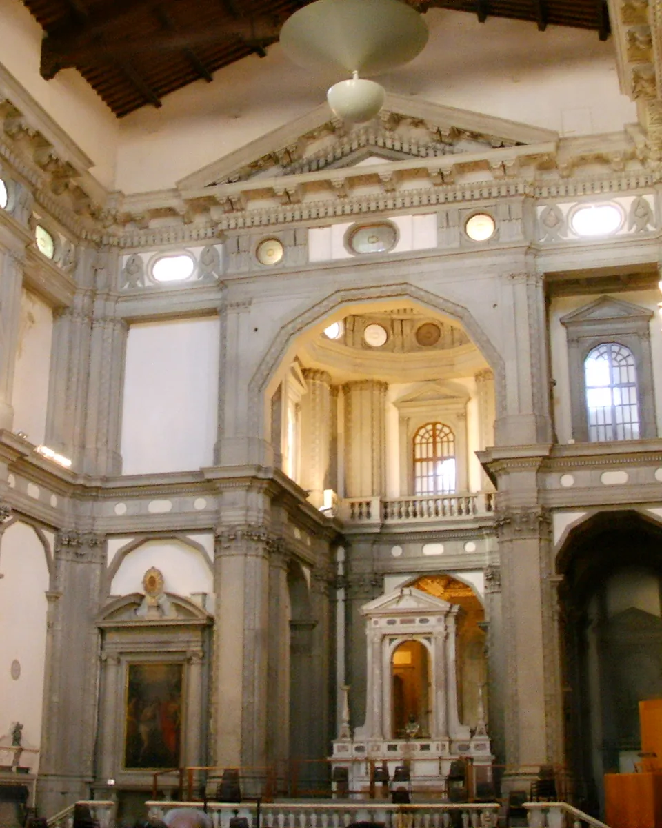 Inside the former church of Santo Stefano al Ponte in 2007: tall grey stone pilasters, pedimented side altars and a wooden ceiling