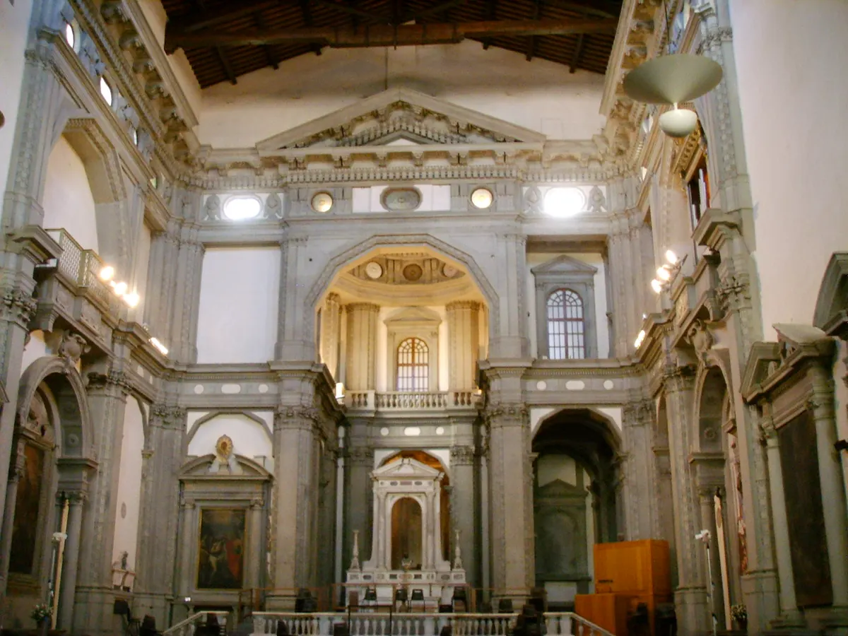 The interior of the church of Santo Stefano al Ponte in Florence in 2007, with tall grey stone pilasters, pedimented altars and a timber ceiling